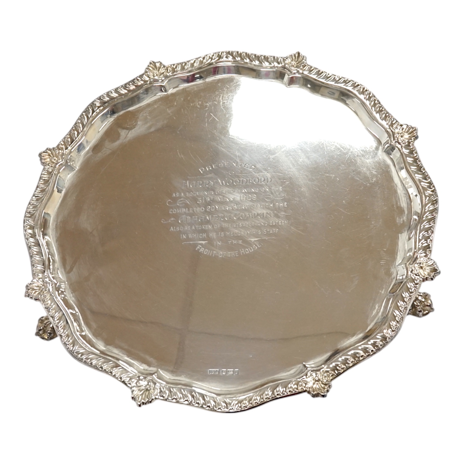 An Edwardian silver salver, with later engraved inscription, on three claw feet, Henry Wigful, Sheffield, 1907, 32.3cm, 27.9oz. Condition - fair to good